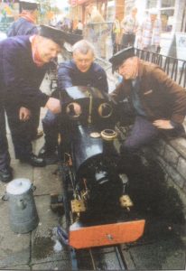 Eric Lander, Harold Jones and Keith Jones, inspecting Keith's Sweet Pea- Talyfan.